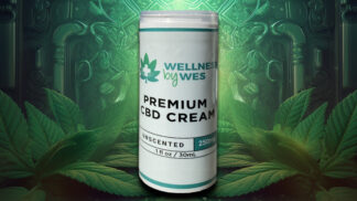 Container of Wellness by Wes Premium CBD Cream, unscented with 250mg CBD, placed amidst lush cannabis leaves.